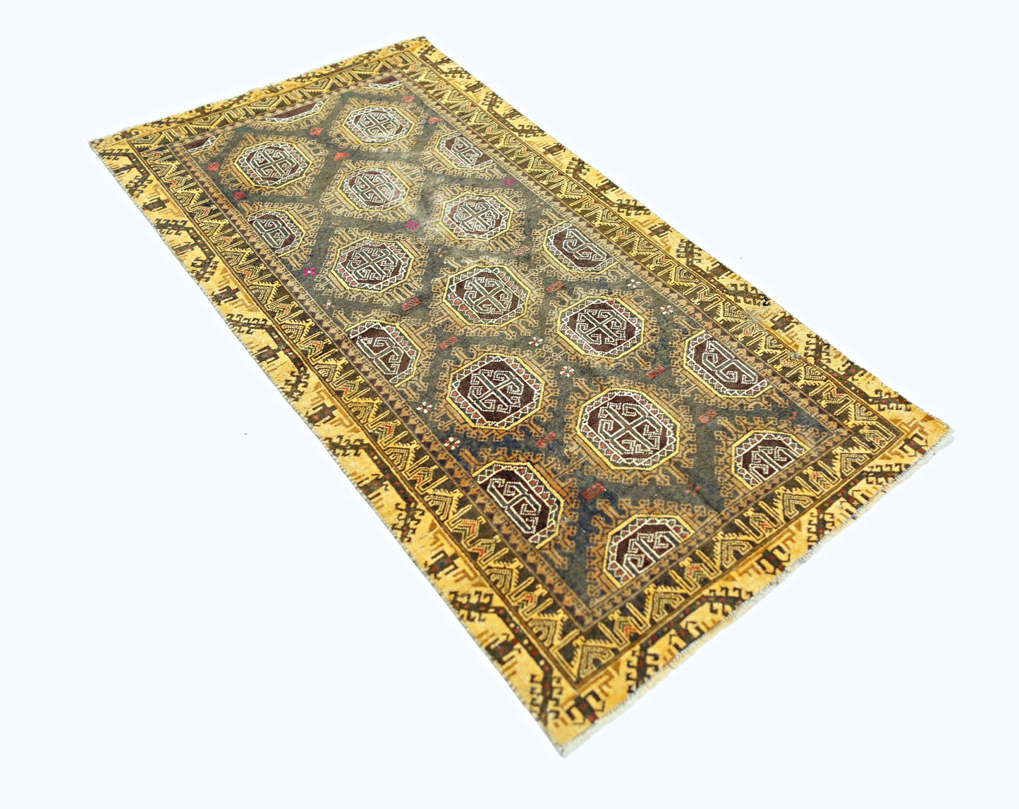 A vintage handwoven Afghan Baluch rug featuring a dark field with repeating geometric motifs.