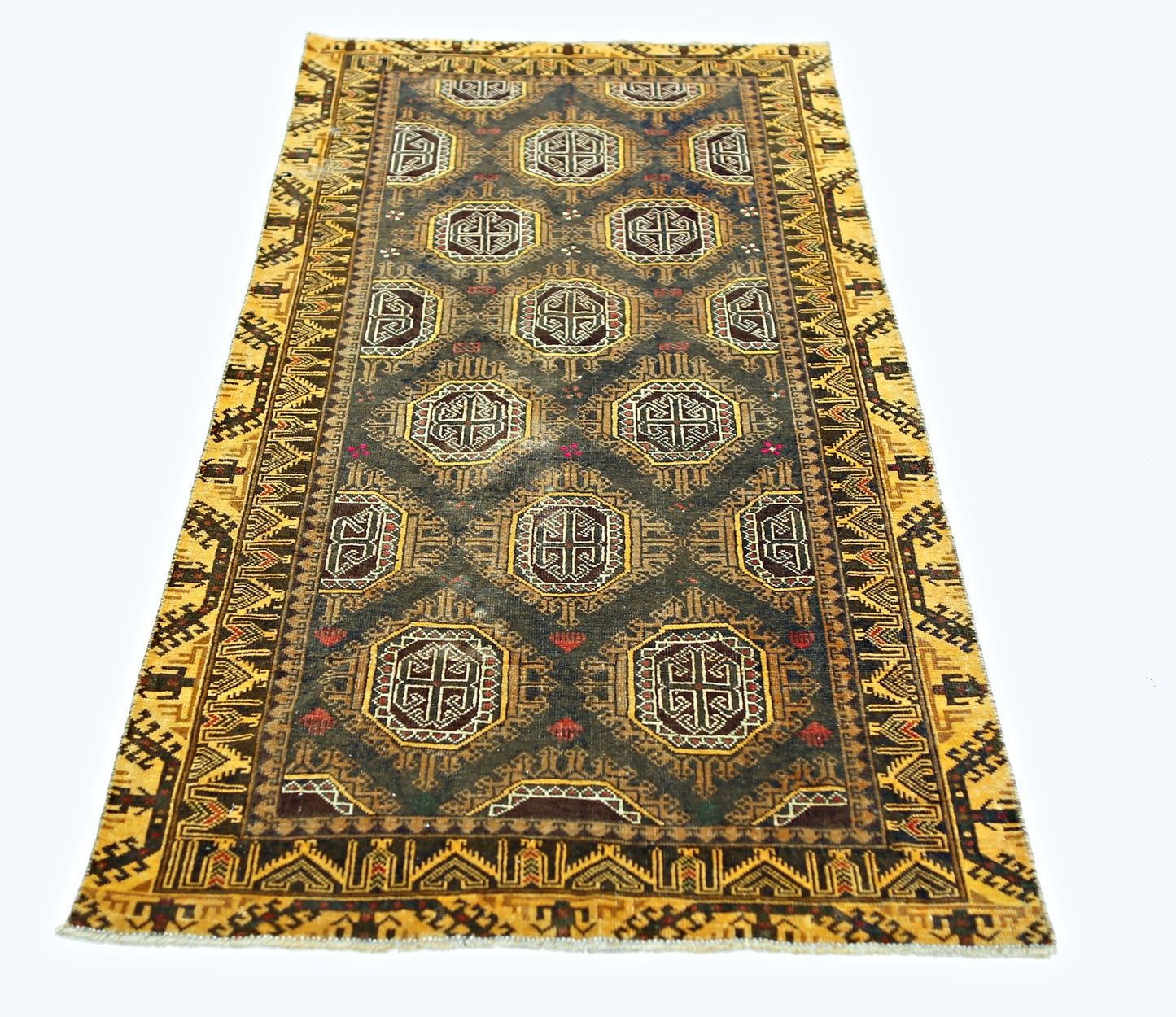 A vintage handwoven Afghan Baluch rug featuring geometric motifs in a dark field with yellow borders.