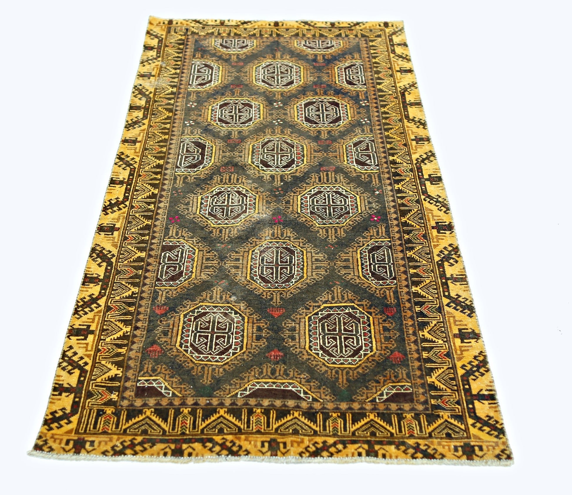 A vintage handwoven Afghan Baluch rug featuring geometric motifs in a dark field with yellow borders.