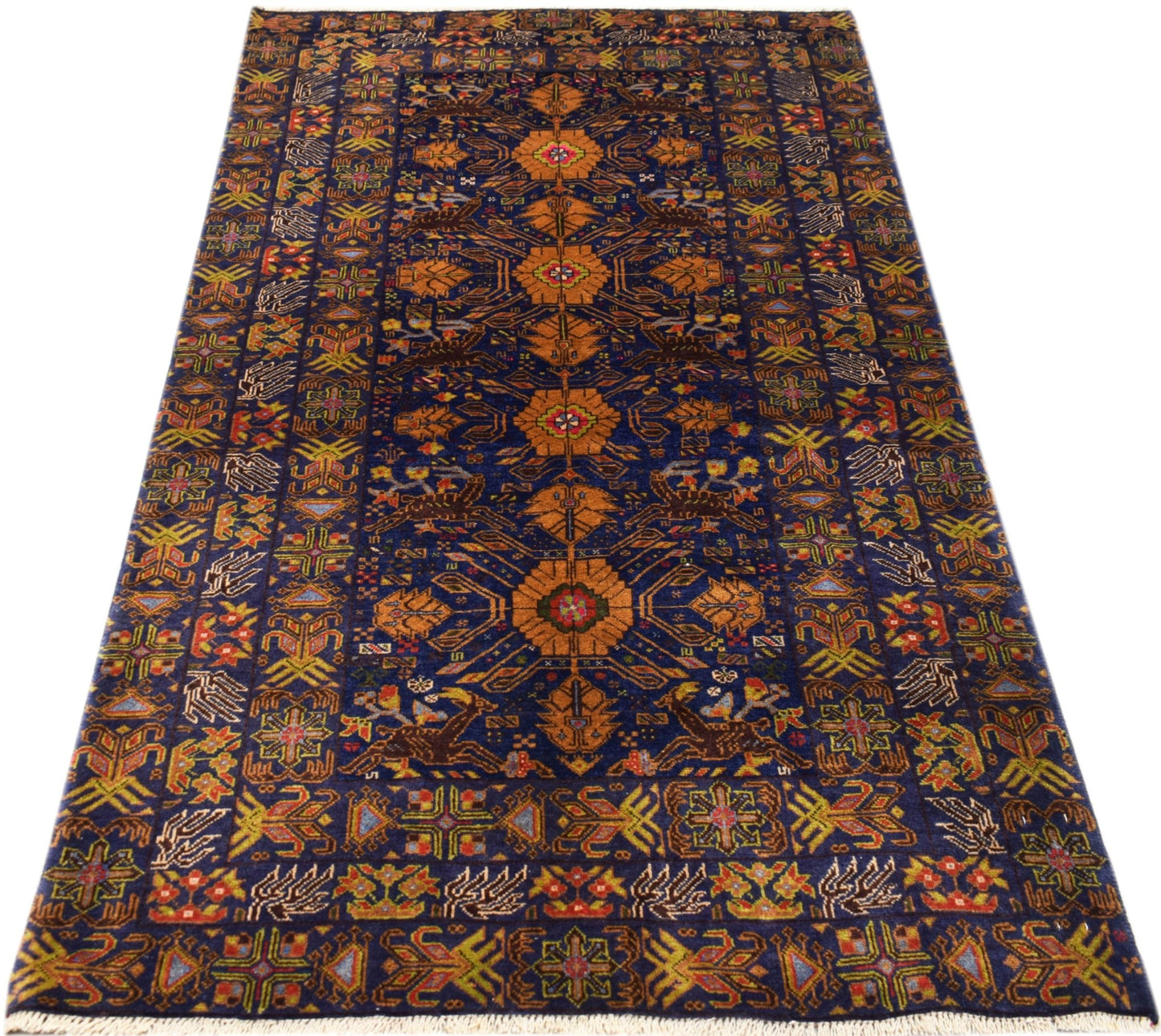 A rectangular vintage Afghan Baluch rug featuring intricate geometric patterns in orange and blue.