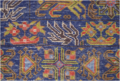 A close-up of a vintage Afghan Baluch rug featuring intricate geometric and floral patterns.
