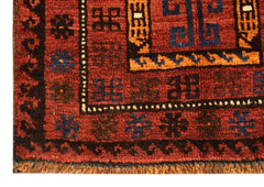 Vintage Afghan Baluch rug with red, blue, and orange geometric patterns.