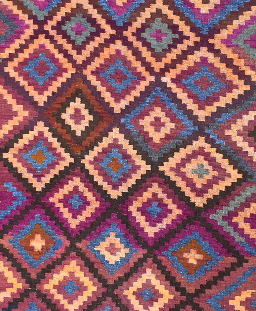 A vintage Afghan Maimana kilim rug featuring a repeating geometric diamond pattern in vibrant colors.