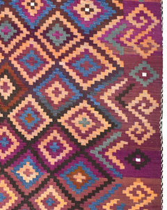 A vintage Afghan Maimana kilim rug featuring a geometric diamond pattern in purple and orange tones.