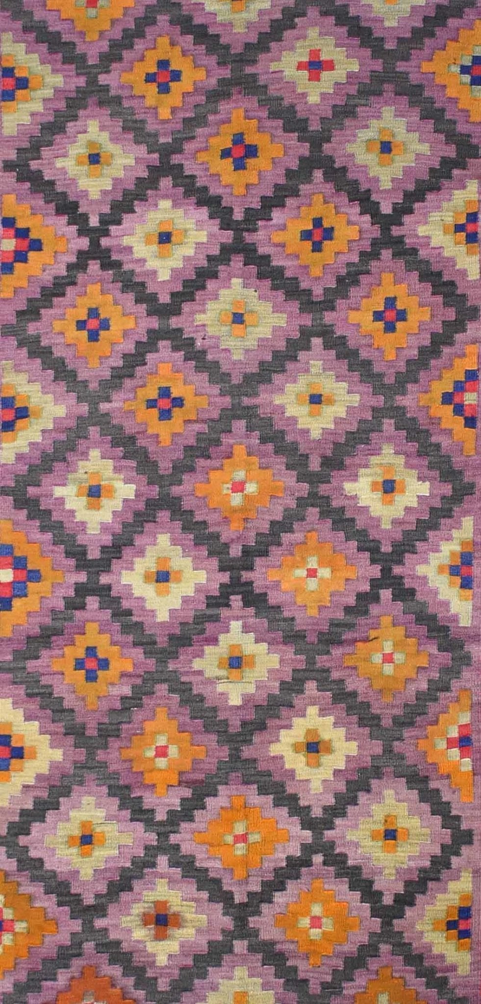 A vintage Afghan Maimana kilim featuring a repeating geometric diamond pattern in purple and orange.