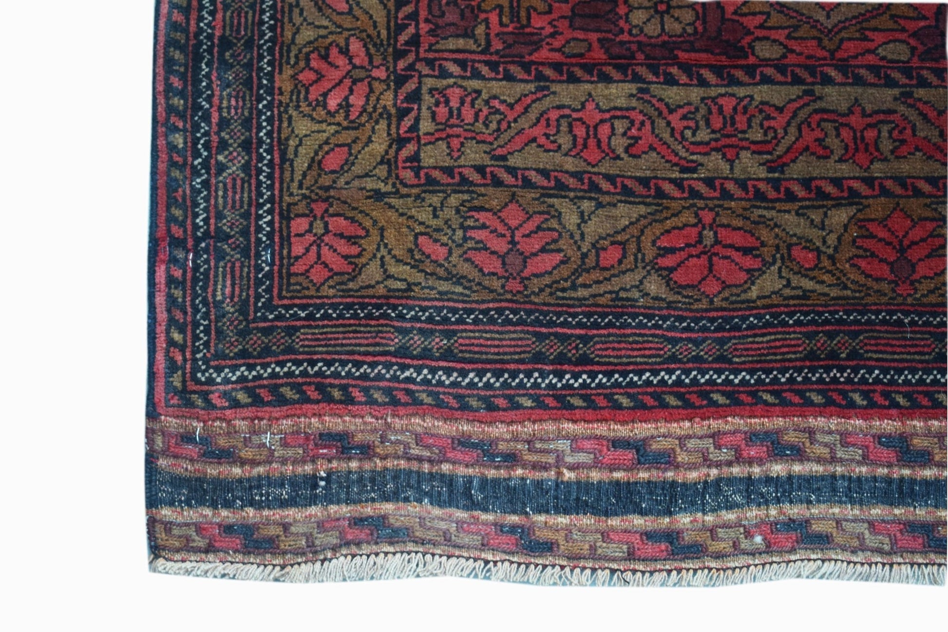 A hand-knotted vintage Afghan runner featuring a traditional Herati pattern in red and brown.