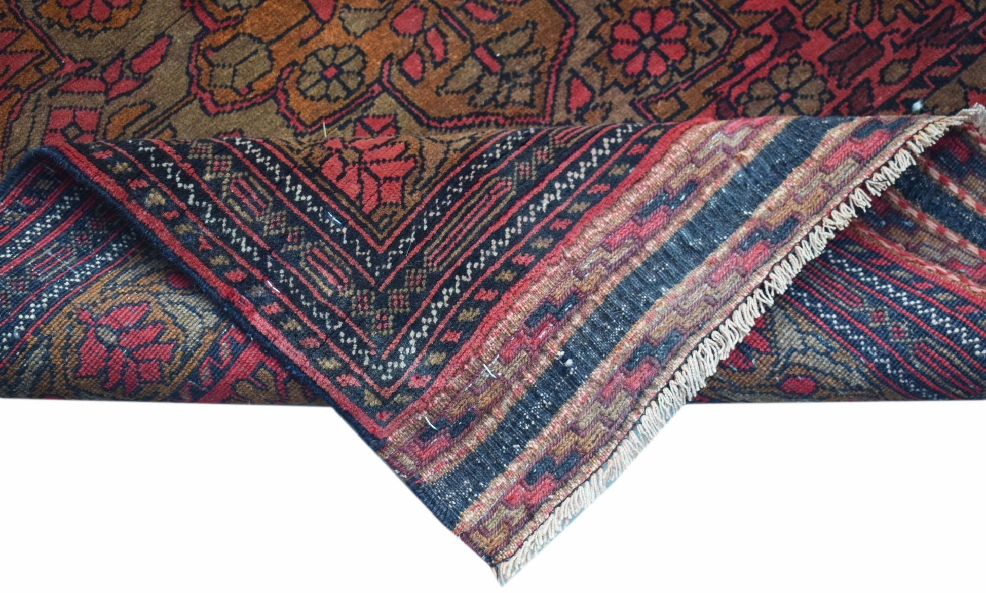 A hand-knotted vintage Afghan runner featuring a traditional Herati pattern in red and brown tones.