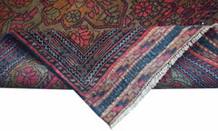 A hand-knotted vintage Afghan runner featuring a traditional Herati pattern in red and brown tones.