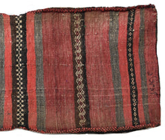 A vintage handmade Afghan wool saddle bag featuring red and grey stripes with geometric patterns.