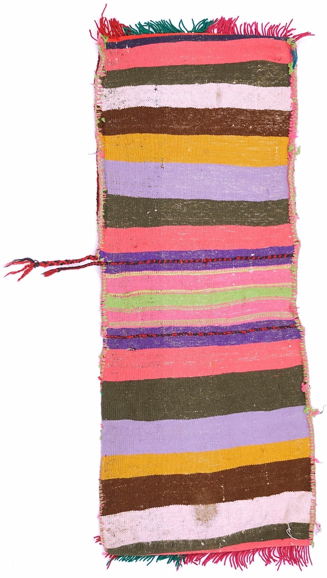 A handmade vintage Afghan wool saddle bag featuring colorful horizontal stripes and fringe.