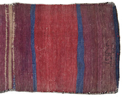 A vintage handmade Afghan wool saddle bag featuring vertical stripes in red, blue, and purple.