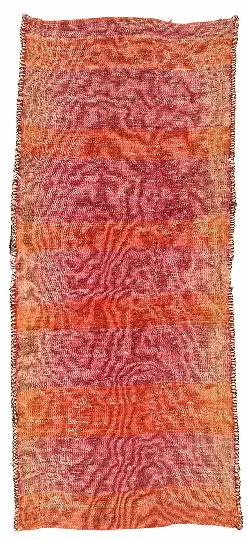 A vintage handmade Afghan wool saddle bag featuring horizontal stripes in shades of red and orange.
