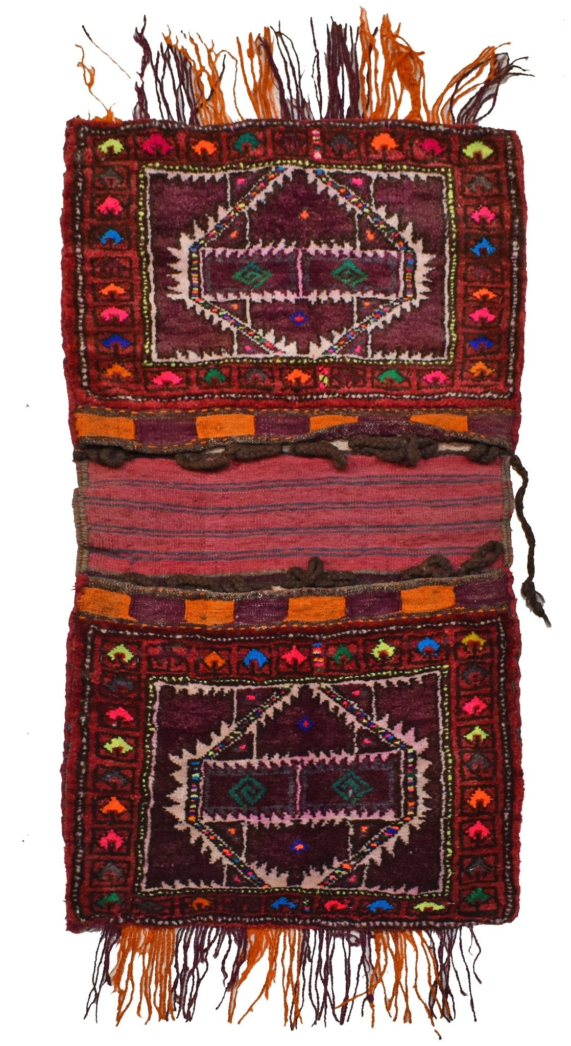 A vintage handmade Afghan wool saddle bag featuring two deep red panels with geometric embroidery.