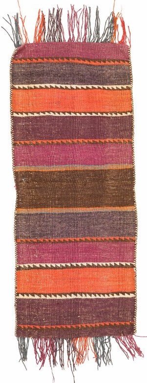 A handmade vintage Afghan wool saddle bag featuring horizontal stripes in orange, purple, and brown.