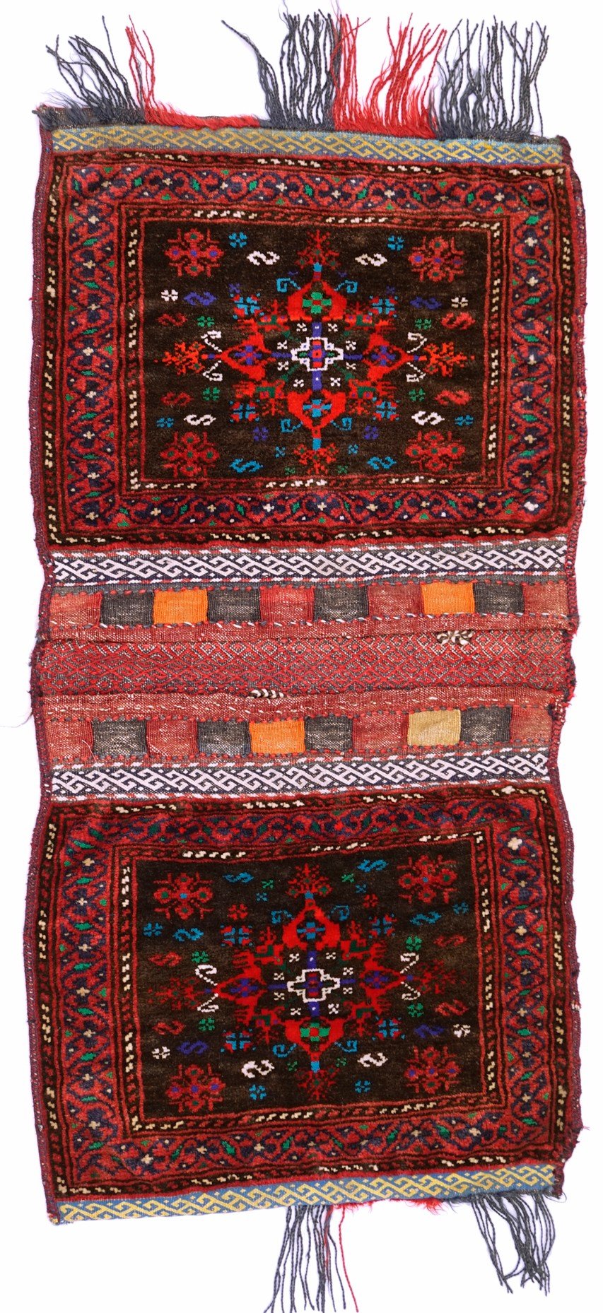A vintage handmade Afghan wool saddle bag featuring two dark red panels with geometric patterns.