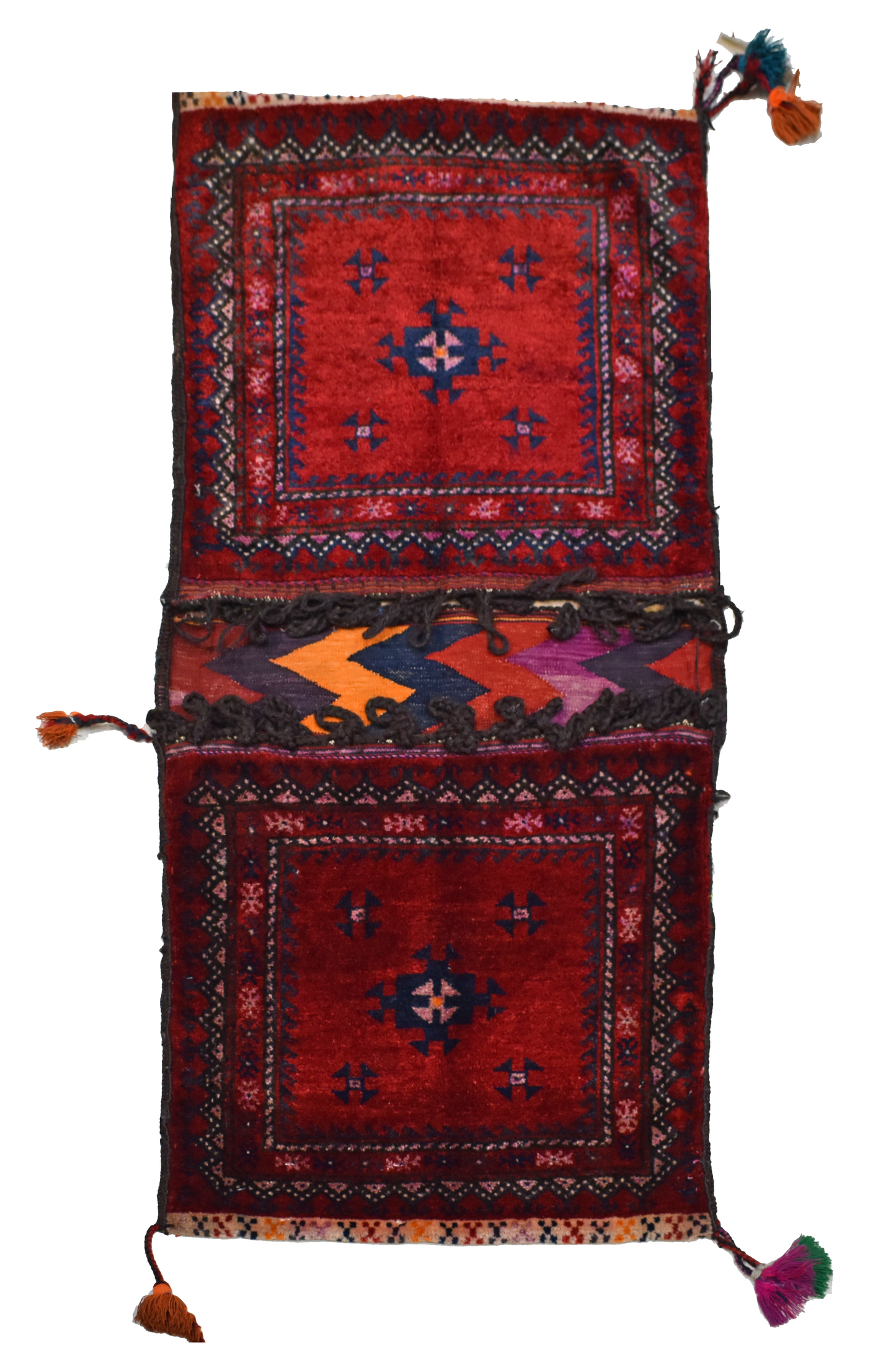 A vintage handmade Afghan wool saddle bag featuring two red square panels with geometric motifs.