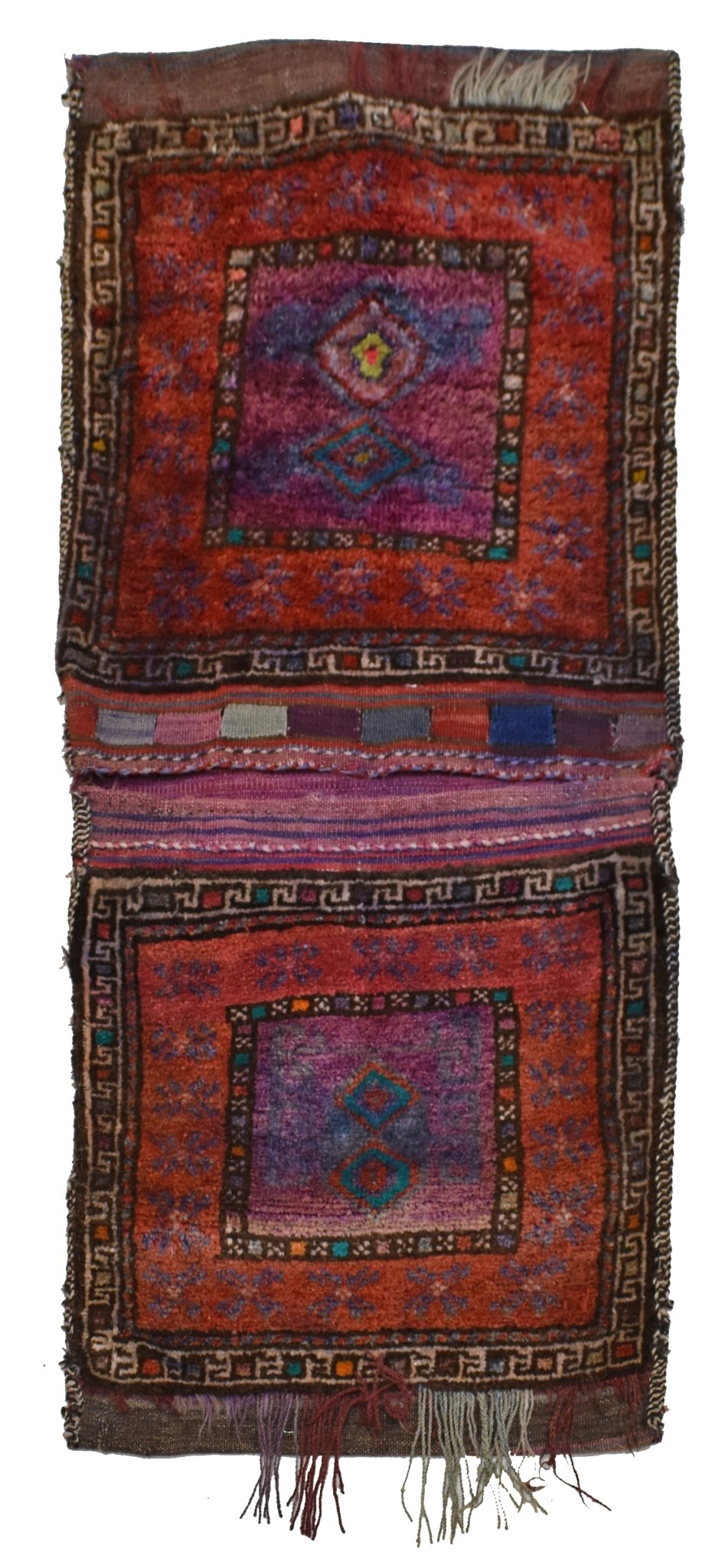 A vintage handmade Afghan wool saddle bag featuring two square panels with geometric patterns.