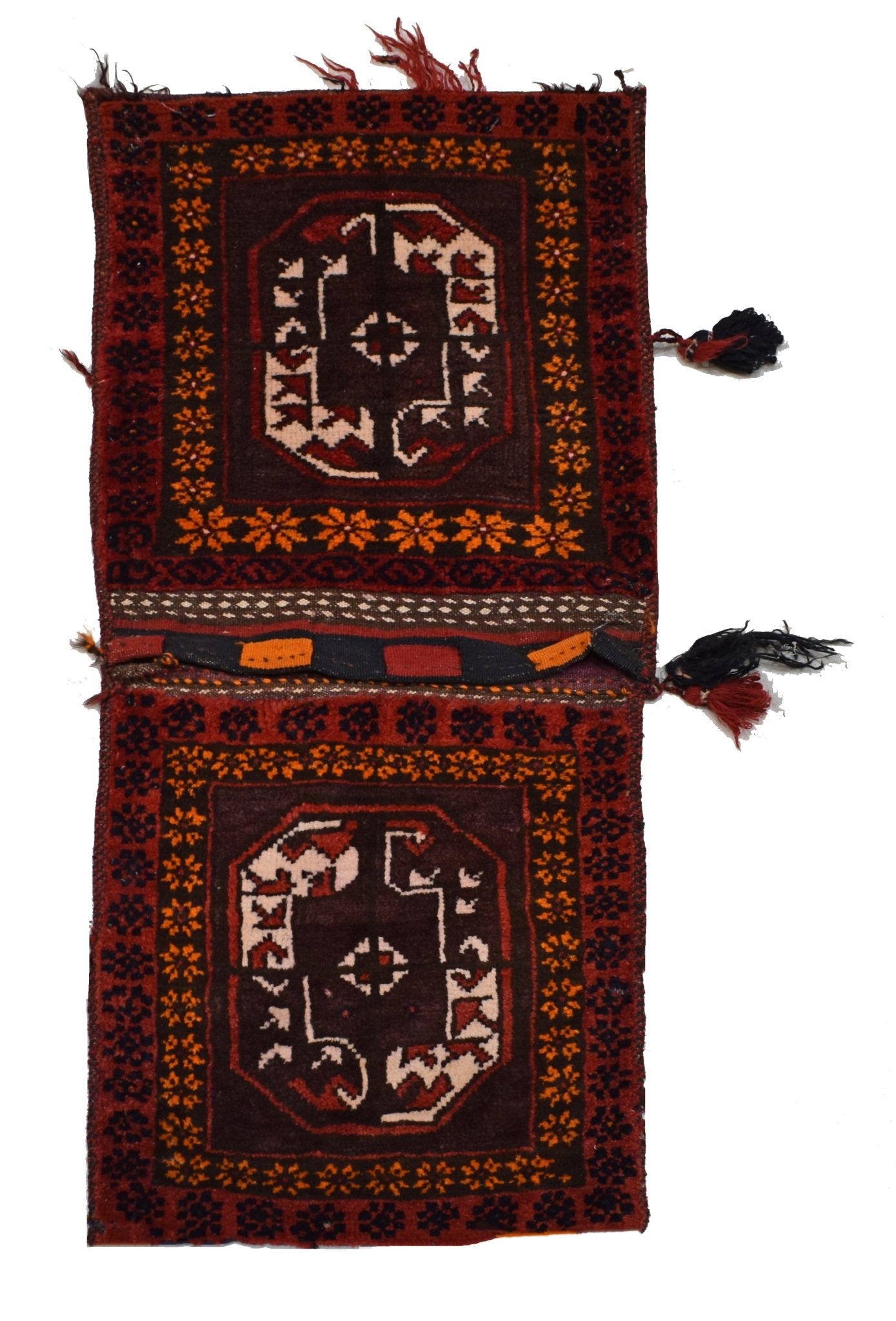 A vintage handmade Afghan wool saddle bag featuring two dark red panels with geometric patterns.