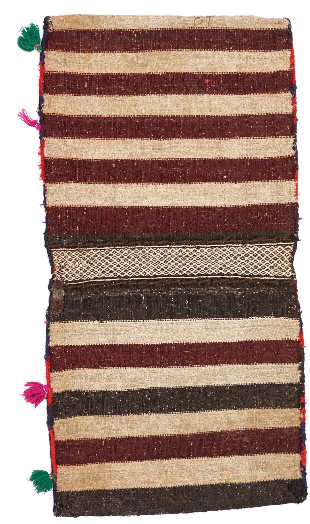 A vintage handmade Afghan wool saddle bag featuring striped patterns and decorative tassels.