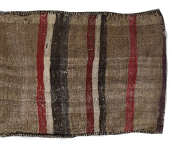 A vintage handmade Afghan wool saddle bag featuring a striped pattern in brown, red, and cream.