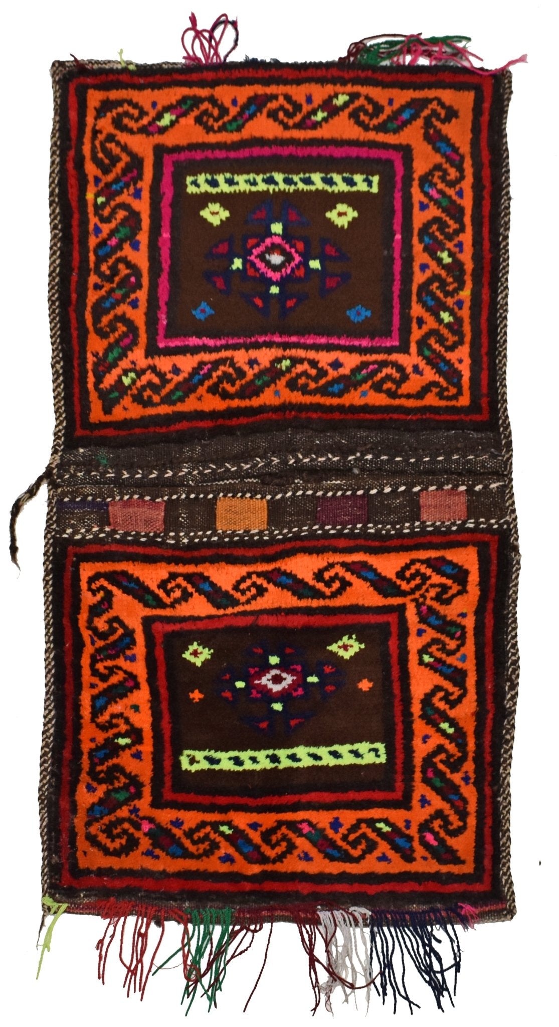 A handmade vintage Afghan wool saddle bag featuring two square panels with geometric patterns.