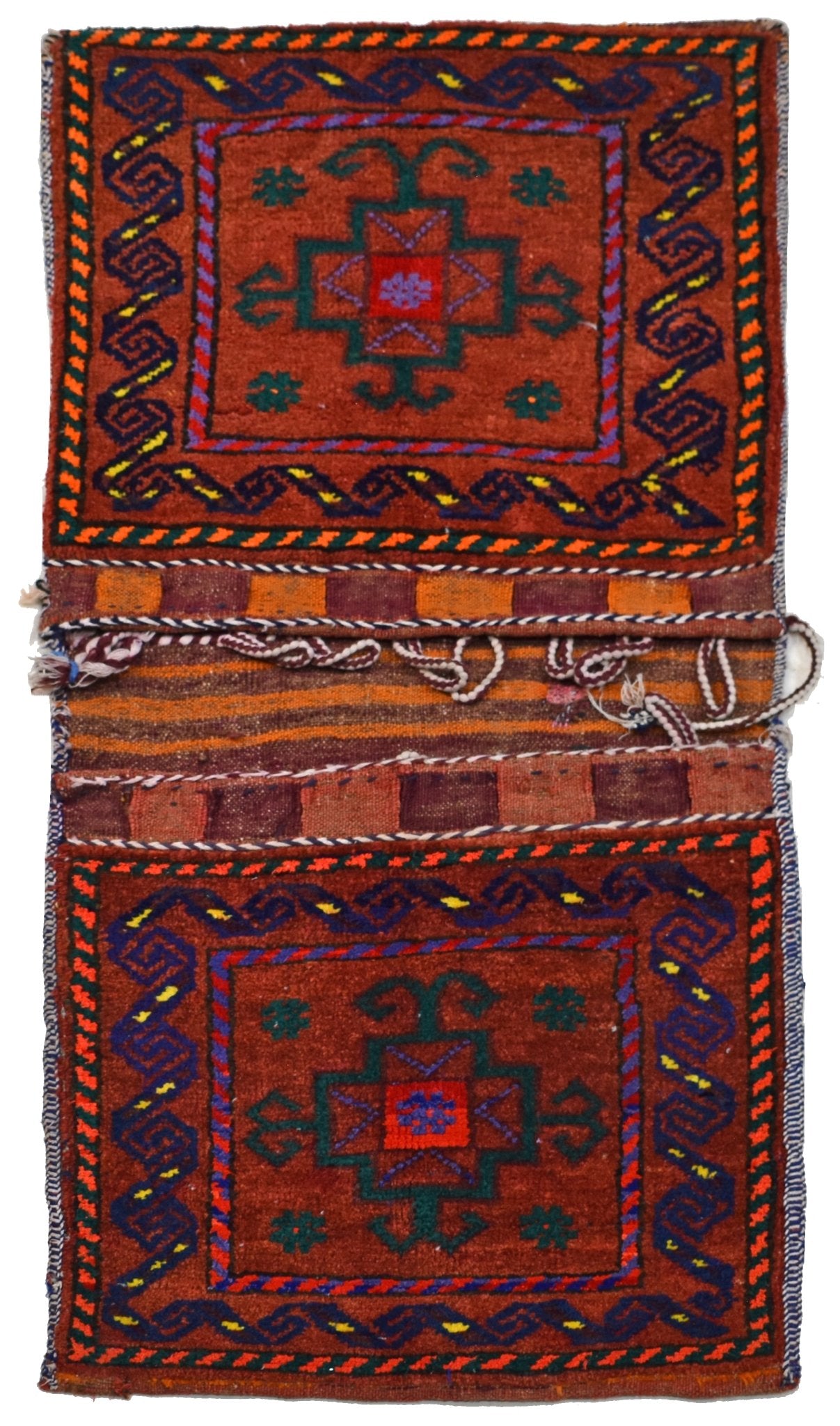A vintage handmade Afghan wool saddle bag featuring two matching red panels with geometric motifs.