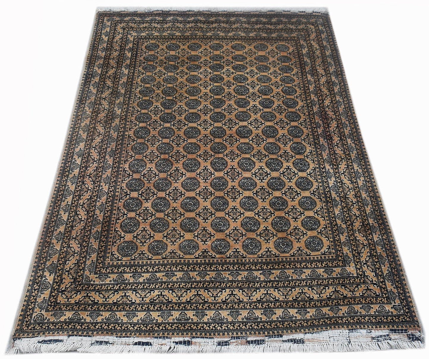 A vintage Afghan Turkmen rug featuring a repeating geometric pattern in black on a tan background.