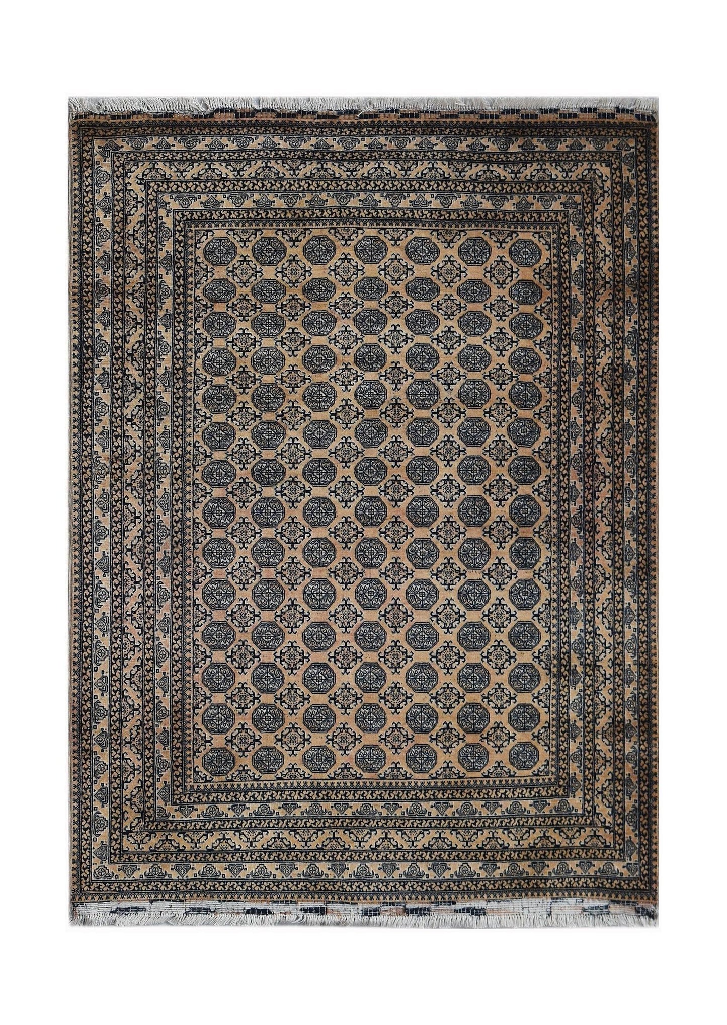 A vintage Afghan Turkmen rug featuring a repeating geometric pattern in dark blue on a tan field.