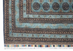 A vintage Afghan Turkmen rug featuring geometric patterns in shades of blue and brown.