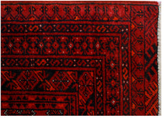 A vintage Afghan Turkmen rug featuring traditional geometric patterns in deep red and black.