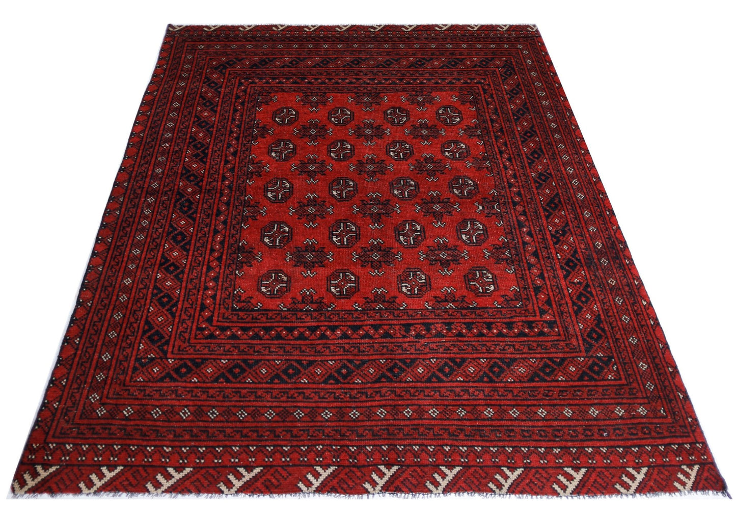 A handwoven vintage Afghan Turkmen rug featuring a repeating geometric pattern in red and black.