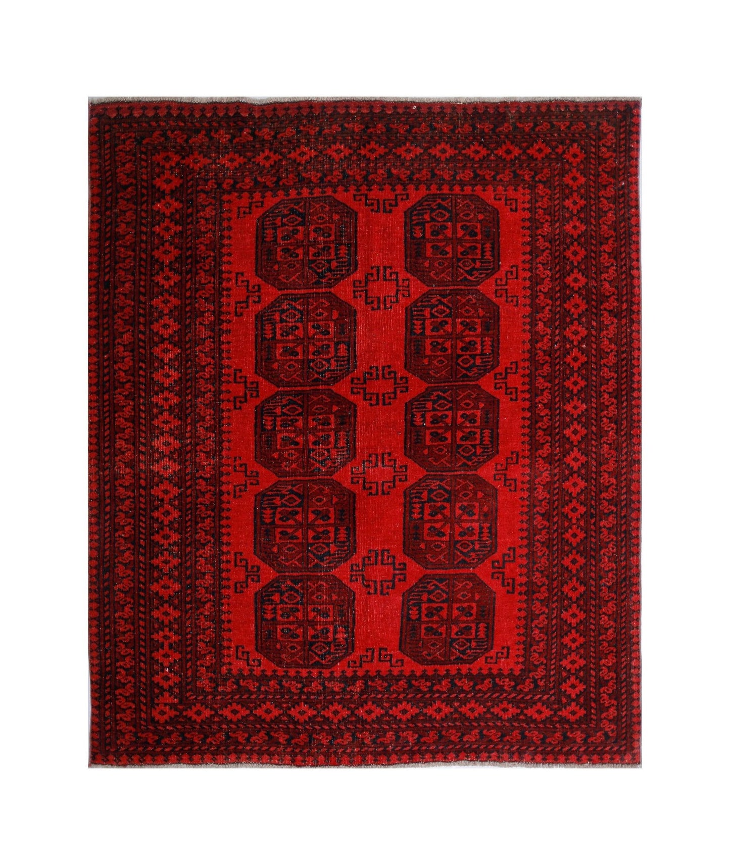 A vintage handwoven Afghan Turkmen rug featuring a repeating octagonal gul pattern in deep red.