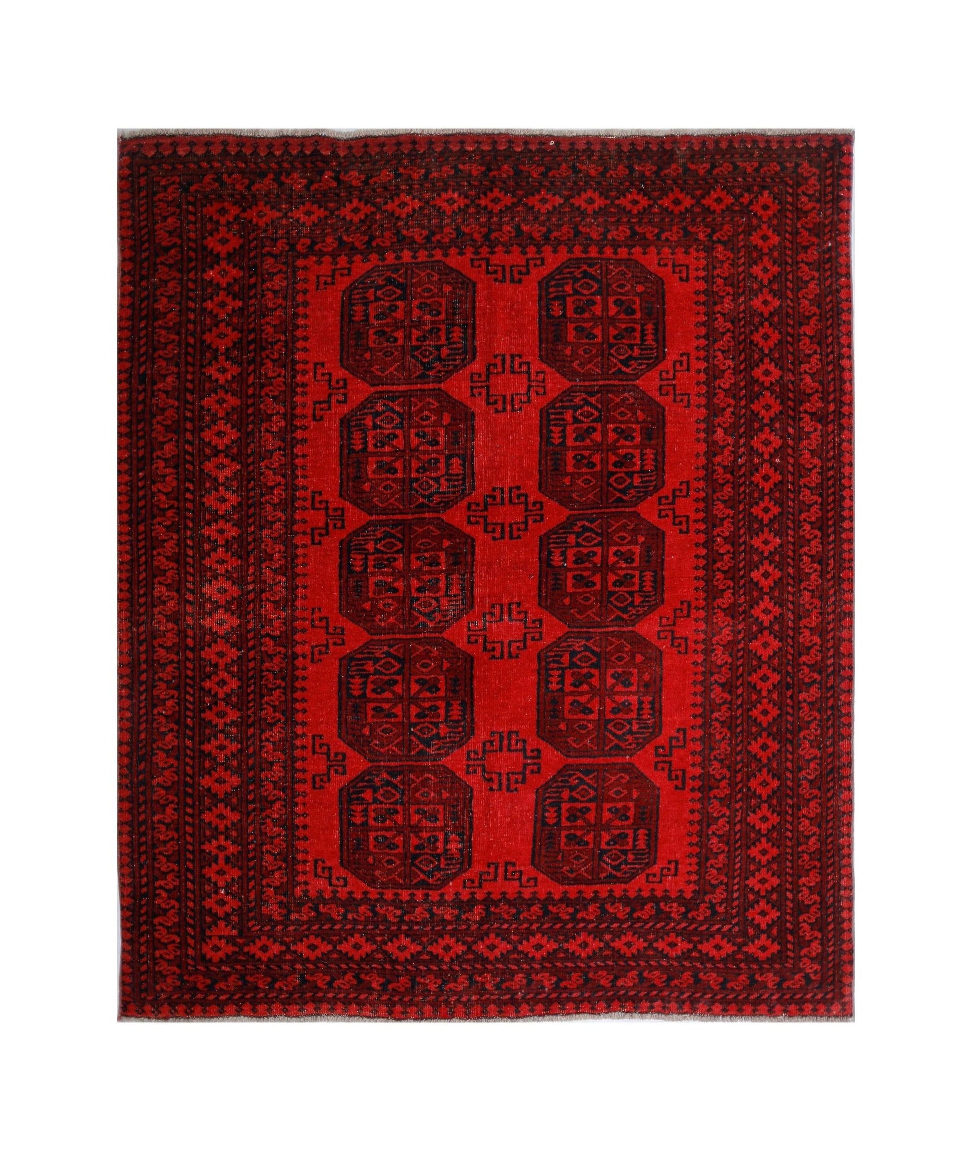 A vintage handwoven Afghan Turkmen rug featuring a repeating octagonal gul pattern in deep red.