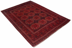 A vintage handmade Afghan Turkmen rug featuring a repeating red elephant foot motif.