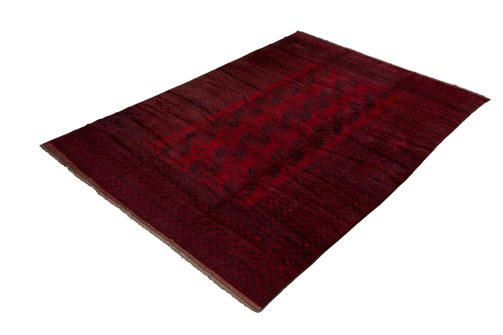 A rectangular handmade vintage Afghan Turkmen rug featuring a deep red field with geometric motifs.