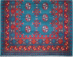 A vintage Afghan Turkmen runner featuring geometric patterns in red, blue, and green wool.