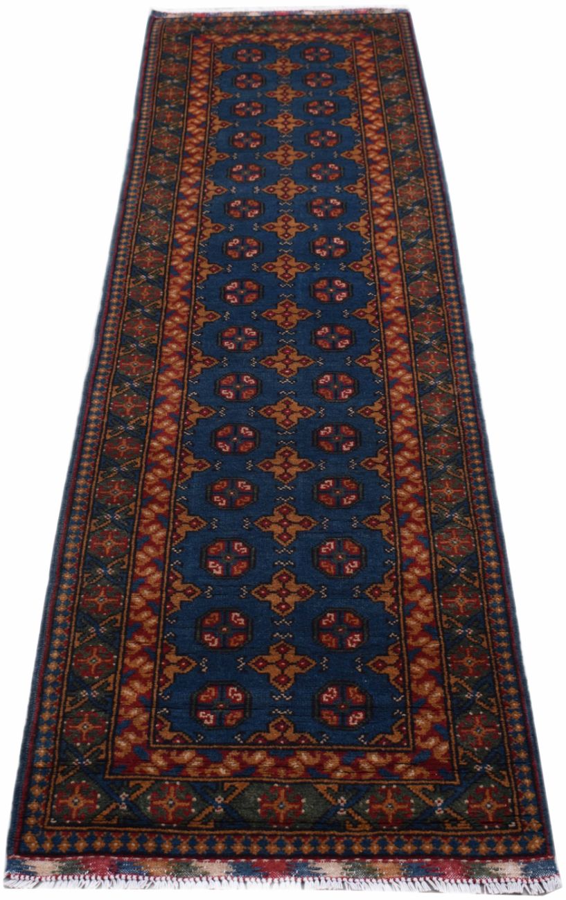 A handmade vintage Afghan Turkmen runner rug featuring geometric patterns in blue and red tones.