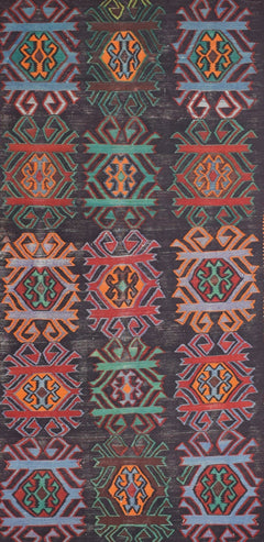 A vintage Caucasian Karabagh kilim featuring a repeating geometric pattern in vibrant wool colors.
