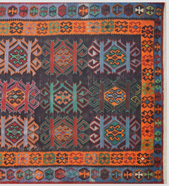 A vintage handmade Caucasian Karabagh kilim featuring geometric patterns in vibrant wool colors.