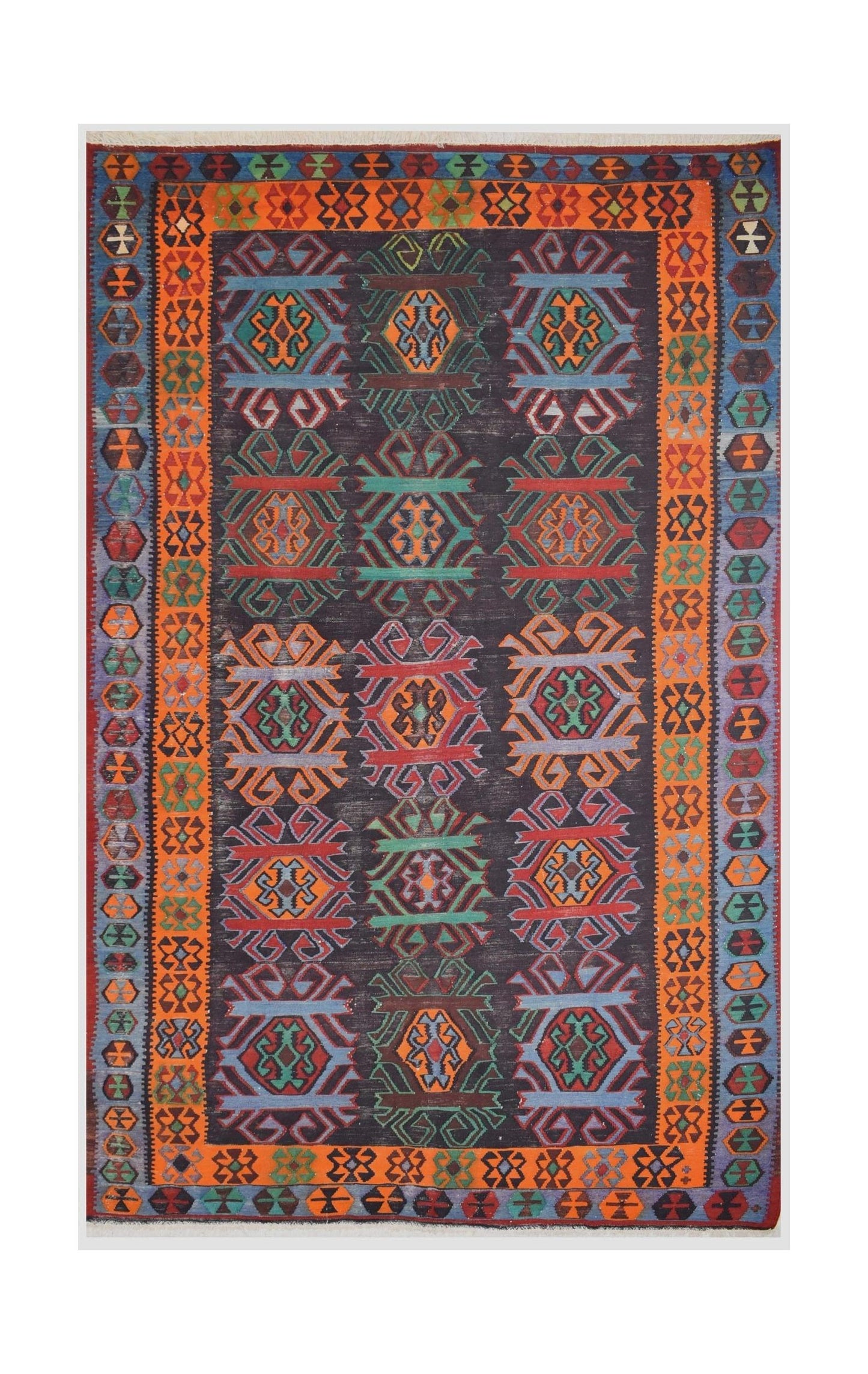 A vintage handmade Caucasian Karabagh kilim featuring colorful geometric patterns on a dark field.