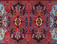 A vintage Caucasian rug featuring a symmetrical geometric pattern in deep red, blue, and yellow.