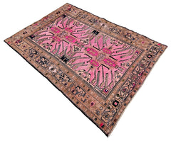 Vintage Caucasian Kazak rug with a bold pink central field, geometric medallions, and a detailed tan border.