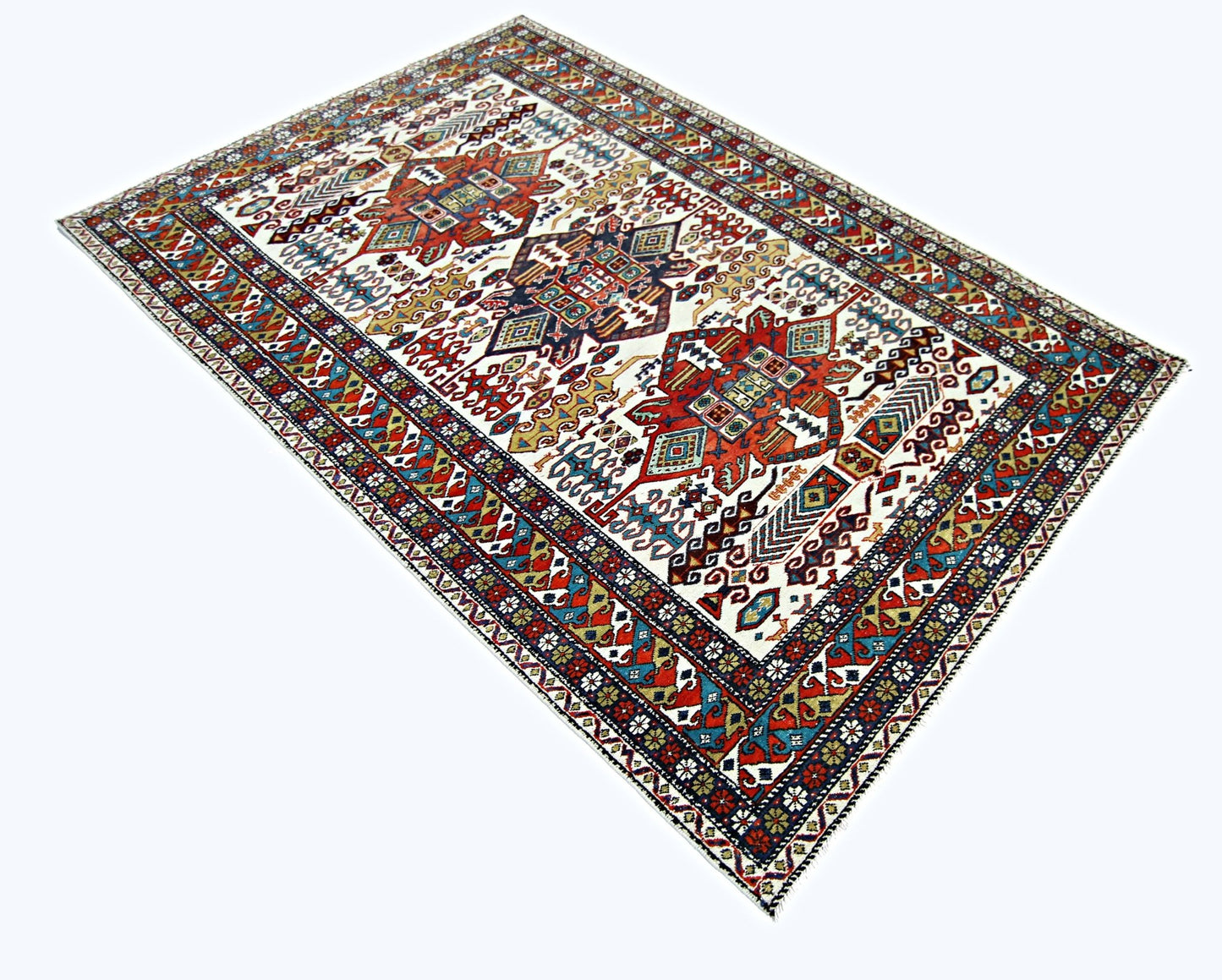 A handwoven vintage Caucasian wool rug featuring a geometric pattern in red, blue, and cream.