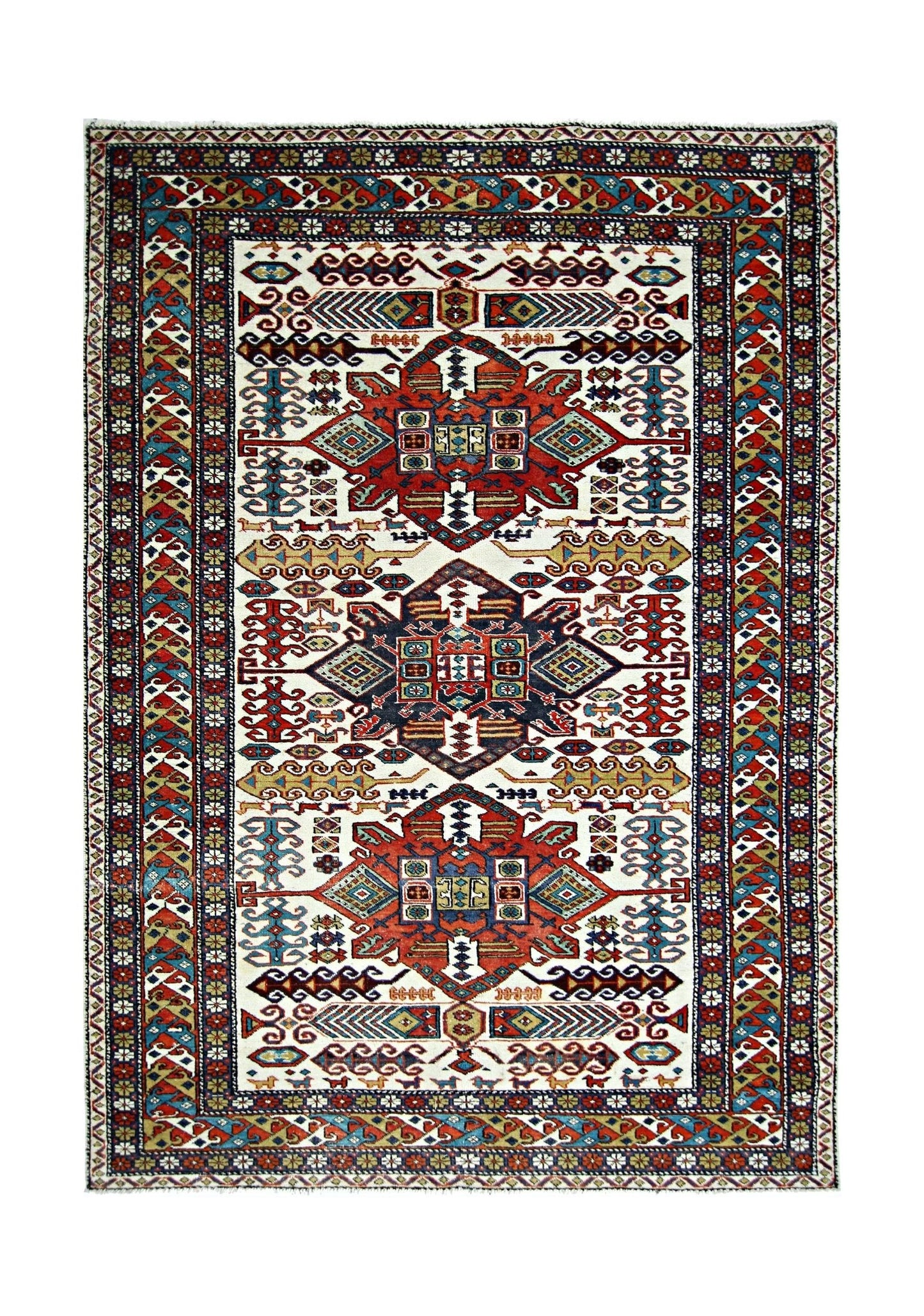 A handwoven vintage Caucasian rug featuring a geometric pattern in red, blue, and cream tones.
