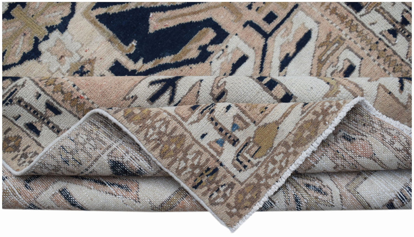 A vintage handmade Caucasian runner featuring a traditional eagle Kazak pattern in wool.