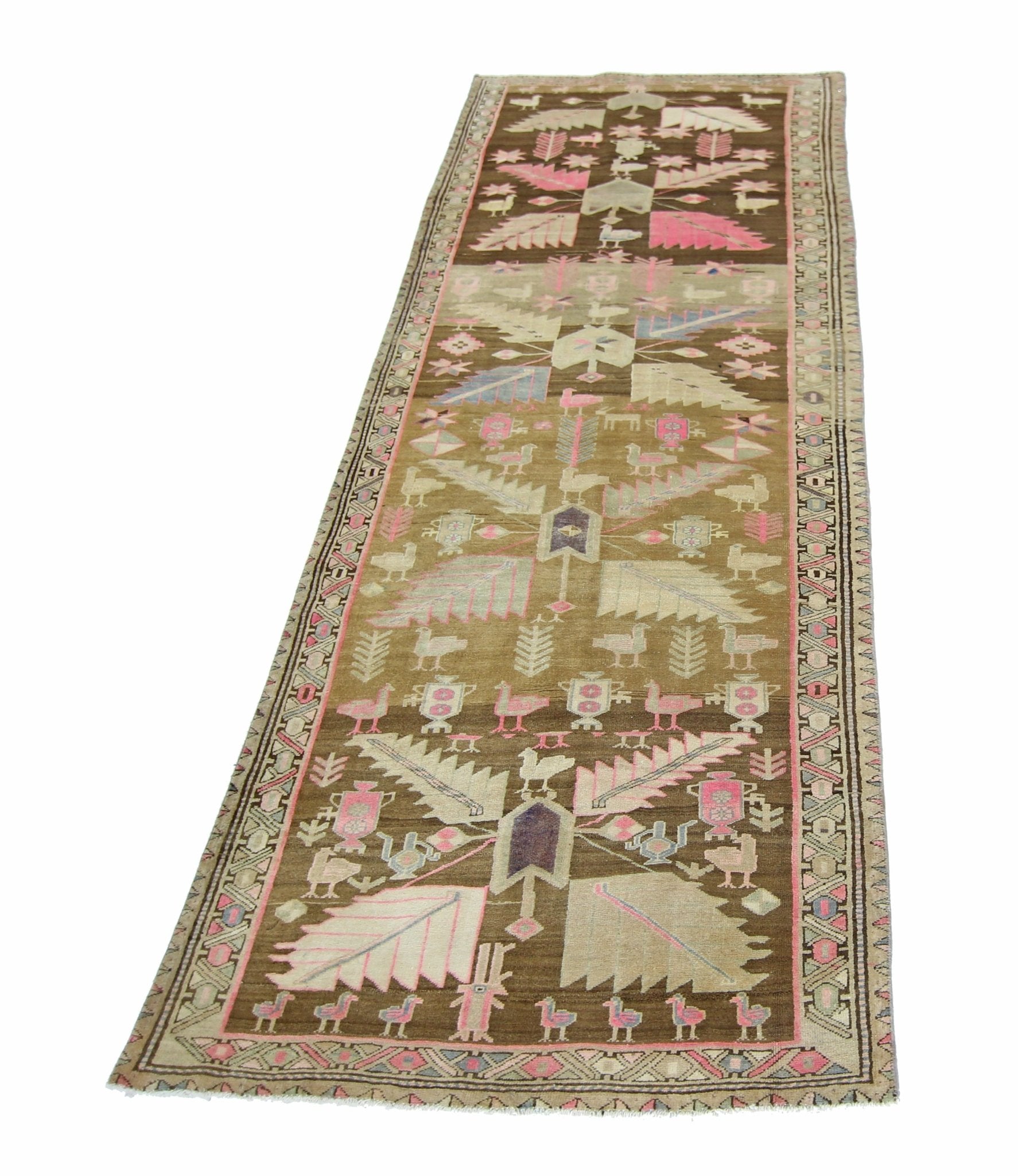 A vintage handmade Caucasian wool runner featuring a brown field with pink and white bird motifs.