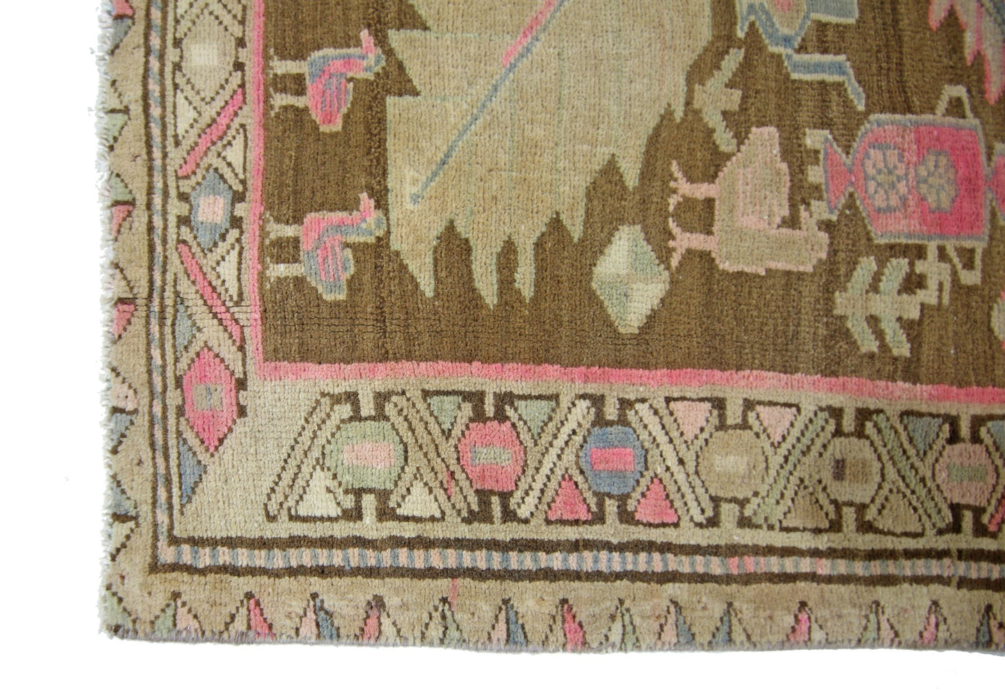 A vintage Caucasian runner featuring a brown field with geometric bird motifs and pink accents.