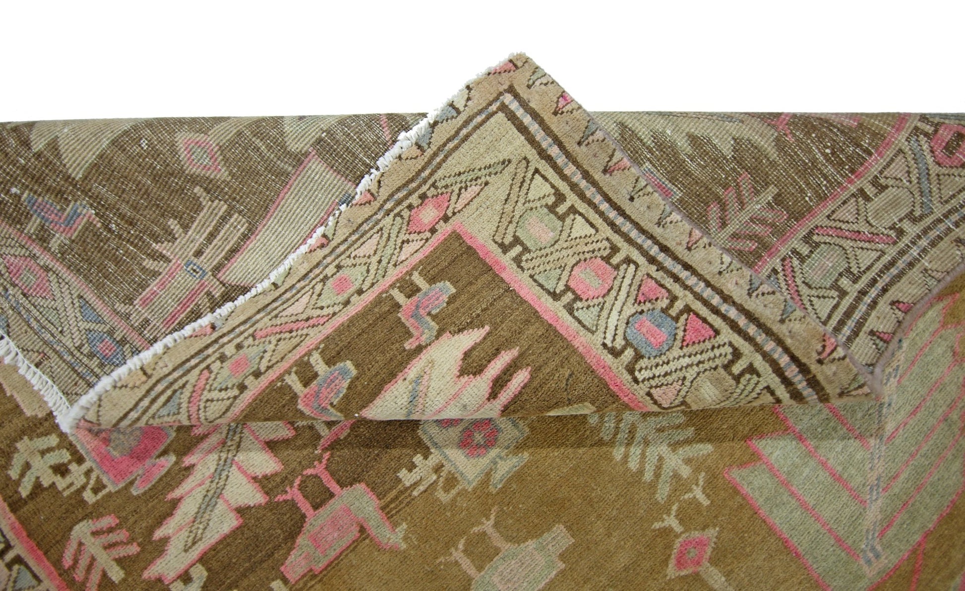 A vintage Caucasian runner rug with a brown background and traditional geometric patterns.