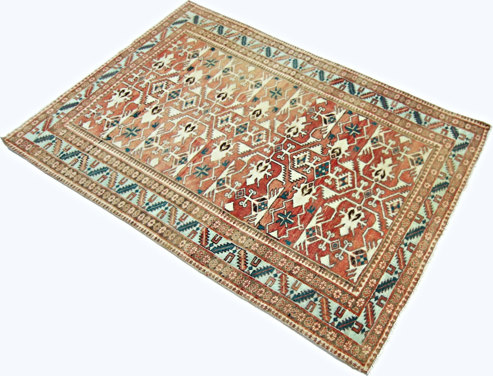 A rectangular vintage Persian rug featuring intricate geometric patterns in red, blue, and cream.