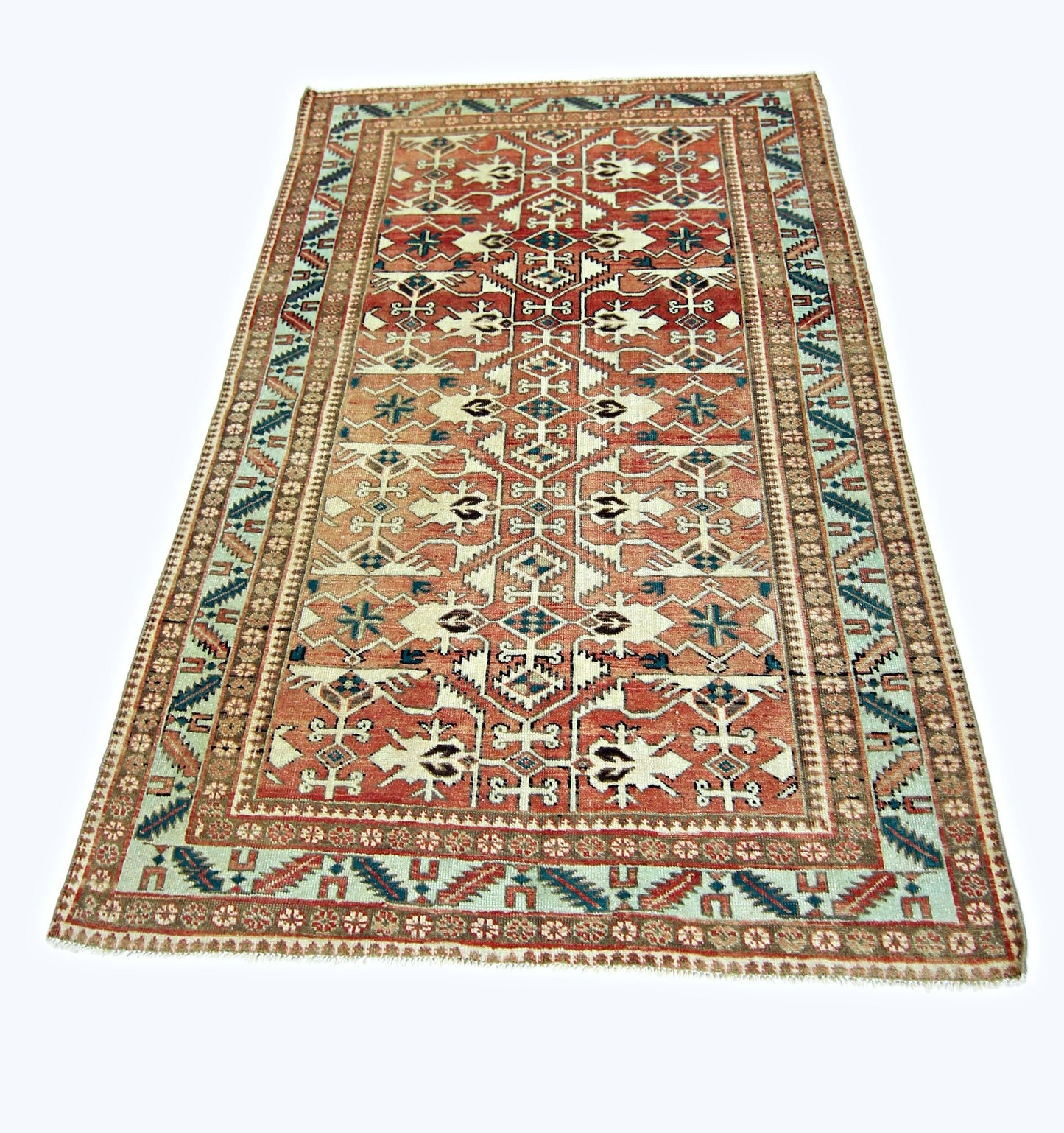 A rectangular vintage Persian rug featuring a geometric pattern in red, blue, and cream tones.